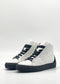 A pair of MH0112 White & Black high-top sneakers, handcrafted in Portugal from premium Italian leathers, featuring a white design with black soles and laces, set against a plain white background.