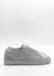 A pair of ML0120 Grey Floater sneakers, featuring a textured surface and thick sole, handcrafted in Portugal, displayed against a white background.