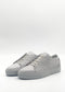 Introducing the ML0120 Grey Floater, a pair of sneakers meticulously crafted from premium Italian leathers. Featuring a textured leather surface and complemented by white laces, these sneakers offer a timeless look on a neutral gray palette. Handcrafted in Portugal, they reflect an ethically made-to-order process that guarantees both quality and sustainability.