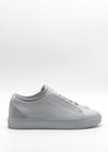 Side view of a pair of ML0123 Grey Floater sneakers crafted from premium Italian leathers, featuring white soles and photographed against a white background.