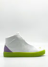 The MH0115 White & Lilac is a white high-top sneaker handcrafted in Portugal, showcasing a bright green sole and a purple heel accent against a plain background.