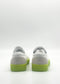 The SO0049 White & Fluorescent Yellow sneakers, featuring vibrant fluorescent yellow soles and carefully handcrafted in Portugal, are displayed from the back on a simple white background.