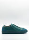 The product image showcases the SO0046 Emerald & Petrol Blue, an ethically made slip-on sneaker. It features a sleek design with premium Italian leathers and a dark sole, all set against a plain white background.