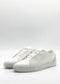 A pair of ML0124 White Floater sneakers, made from white leather and handcrafted in Portugal with laces, are showcased against a plain white background.