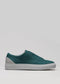 Side view of the V40 Ocean Blue W/ Plaster sneaker, featuring a teal color with a white sole and gray heel accent, crafted from premium Italian leathers, set against a plain background.