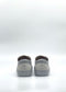 A pair of SO0038 Grey & White sneakers, handcrafted in Portugal, viewed from the back against a plain white background.