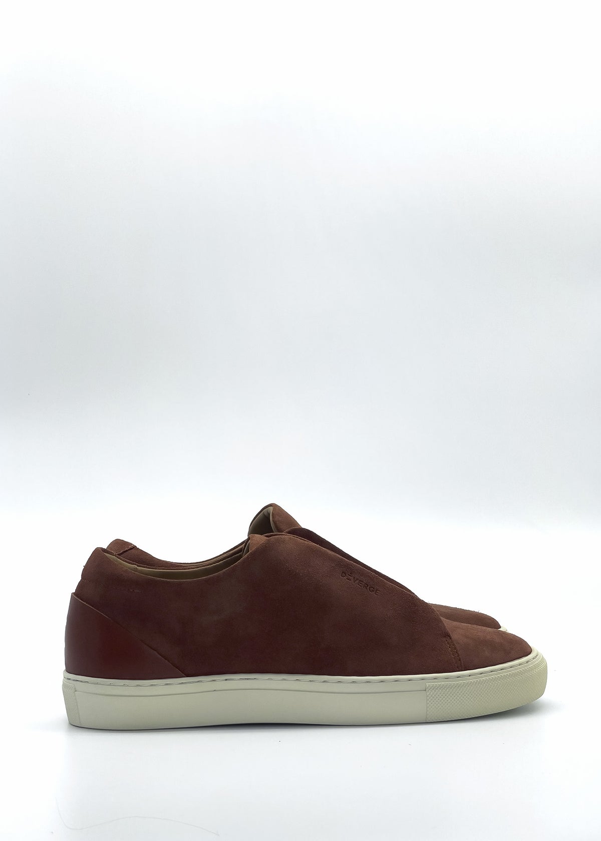 Side view of the ML0115 Caramel, an ethically made brown suede low-top sneaker handcrafted with premium Italian leathers, on a white background.