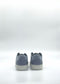 The ML0116 Arctic Blue sneakers, handcrafted in Portugal, are showcased from the back against a plain white background.