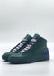 The MH0147 Emerald Green & Purple sneakers are handcrafted from premium Italian leather, featuring dark green coloring with purple heel accents and light pink laces set against a plain white background.