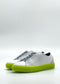 ML0111 White & Lime sneakers, featuring lime green soles and handcrafted in Portugal, are shown from the side against a plain background.