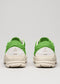 Rear view of the V11 Brat sneakers, featuring a green and white color block design with thick white soles, displayed on a plain background.