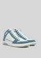 The V7 White W/ Arctic Blue sneakers are high-tops featuring white and blue suede panels, equipped with white laces and a textured sole, crafted from premium Italian leathers.