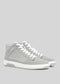 The V4 Grey W/ Plaster is a pair of gray high-top sneakers, handcrafted in Portugal with premium Italian leathers, featuring white soles and laces, displayed on a plain gray background.