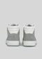 Rear view of the V8 White W/ Plaster high-top sneakers, crafted in Portugal, displayed on a gray background.