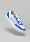 A white and blue low top sneaker with a classic design on a gray background was replaced with Novo Nordisk.