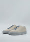 The SO0034 Beige & Blue slip-on sneakers are handcrafted in Portugal, showcasing beige uppers and light gray soles against a plain background.