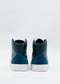 Back view of a pair of Ocean Blue high-top sneakers crafted from premium Italian leathers with white soles on a white background, ethically made to order.