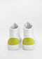 The MH0072 White W/ Yellow high-top sneakers, featuring fluorescent green suede on the heels and handcrafted in Portugal from premium Italian leathers, are shown from the back against a plain background.