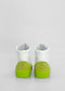 A pair of MH0088 White Leather W/ Lime handcrafted white high-top sneakers with green soles and green heel accents, made from premium Italian leathers, viewed from the back against a plain white background.