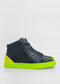 The ML0098 Black features black high-top sneakers with vibrant neon green soles and heel accents, expertly crafted from premium Italian leathers.