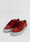 ML0077 Red W/ Grey low-top sneakers with white soles, red laces, and a matte finish, handcrafted from premium Italian leather, placed on a clean white background.