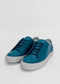 A pair of ML0083 Blue Leather sneakers with white rubber soles, handcrafted in Portugal using premium Italian leathers, displayed against a plain white background.