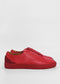 A pair of ML0060 Red Leather sneakers, handcrafted in Portugal from premium Italian leathers, with a smooth finish and minimal detailing, positioned side-by-side against a white background.