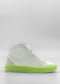 The MH0113 White Leather W/ Lime is a white high-top sneaker featuring a bright green sole and a minimal design, crafted from premium Italian leathers and ethically made to order in Portugal, presented against a plain grey background.