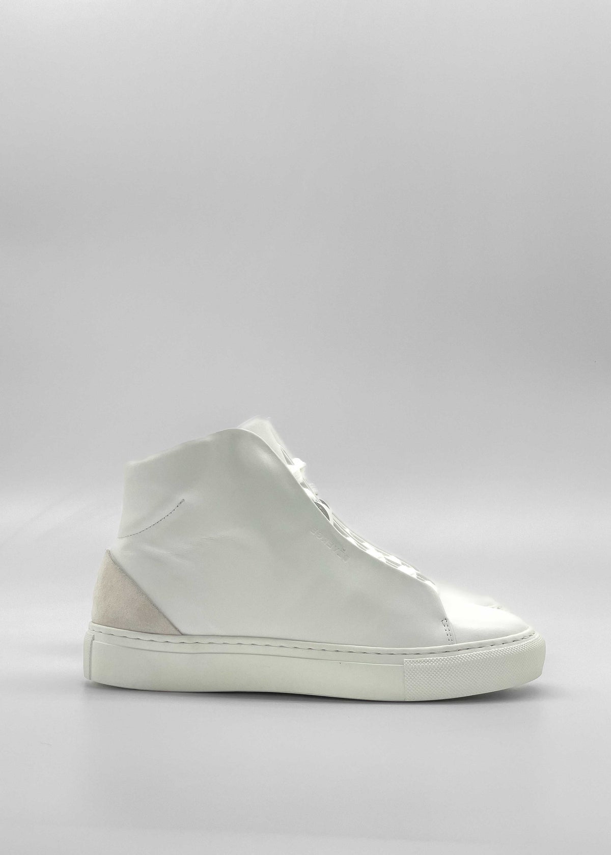 The MH0118 White Leather W/ Bone high-top sneaker, showcasing a clean, minimalist design, is displayed against a plain, light background. Handcrafted in Portugal from premium Italian leathers, it features a distinctive suede patch on the heel.