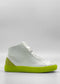 The MH0120 White Leather W/ Lime high-top sneakers feature a neon green sole and heel accent, crafted from premium Italian leathers. Handcrafted in Portugal for ultimate quality and style, these sneakers are showcased against a plain white background.