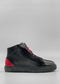 A pair of MH0124 Black Leather W/ Red high-top sneakers, featuring red laces and red accents on the heels, meticulously handcrafted from premium Italian leathers.