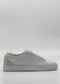 Side view of the ML0094 Grey Floater W/ Plaster, a white low-top sneaker with a textured surface, light gray detailing at the heel, and handcrafted in Portugal using premium Italian leathers.