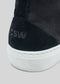 Close-up of the CRITICAL III, a handcrafted black high-top sneaker made in Portugal, featuring "CSW" printed on the heel and a white rubber sole.