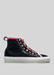 The CSW 2 sneaker, a black high-top handcrafted in Portugal from premium canvas with white laces, a red trim, and a white sole, is shown against a gray background.