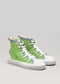 Introducing the V13 Brat: a pair of multi-layered high-top sneakers crafted from premium green canvas, featuring white rubber soles and blue accents. They boast white laces and a pull tab at the heel, meticulously handcrafted in Portugal.