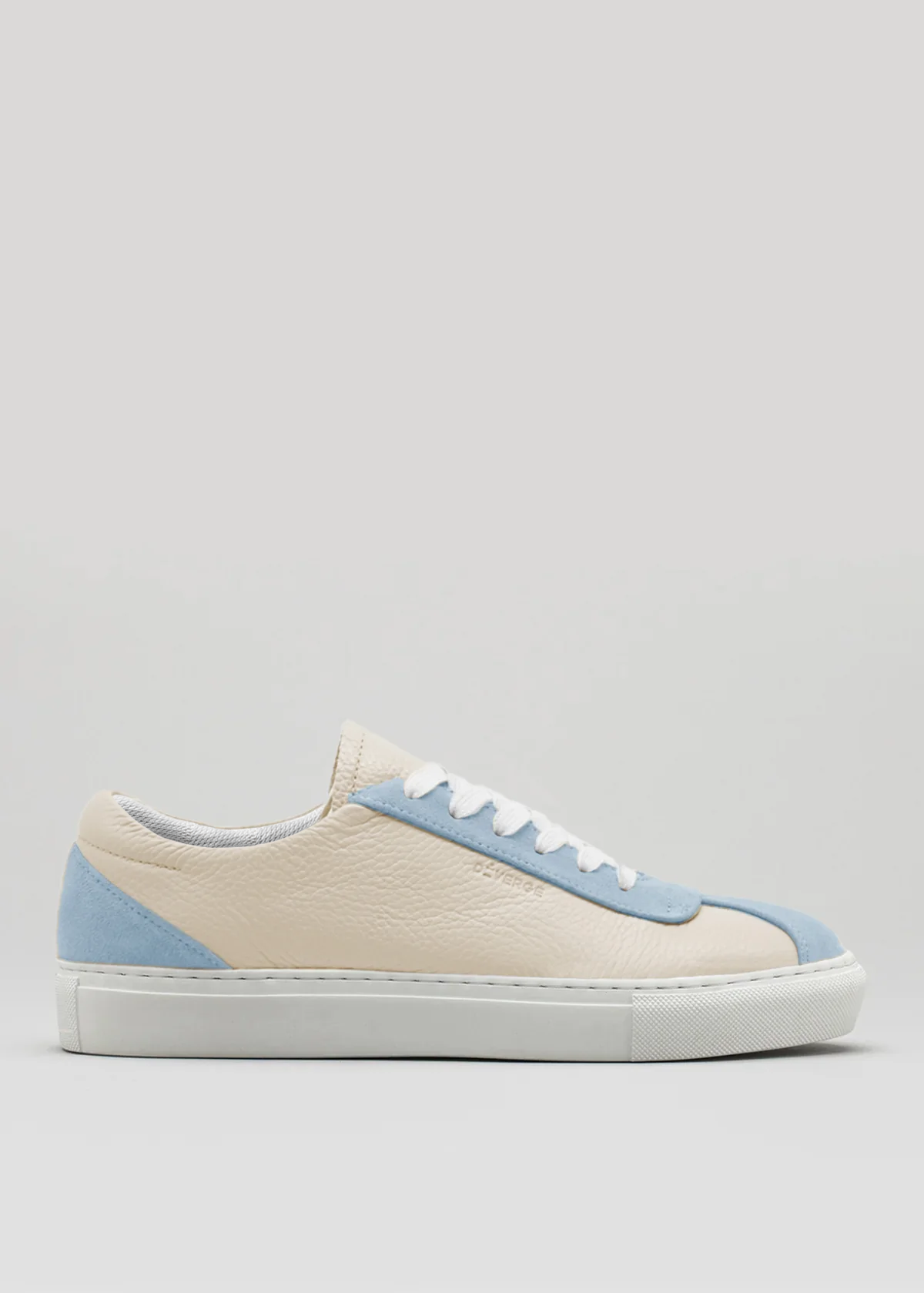 The V6 Beige & Arctic Blue is a low-top sneaker, handcrafted in Portugal, showcasing a beige and blue design with white laces and a sleek white sole, set against a plain background.