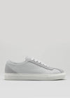 The V4 Grey is a white leather low-top sneaker, handcrafted in Portugal, featuring gray accents on a clean background.