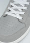 Close-up of the V4 Grey W/ Plaster high-top sneaker, featuring white laces, premium Italian leathers, a perforated toe, and meticulous craftsmanship from Portugal.