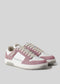 Pair of M0013 by Lina with pink suede accents, white laces, and perforated details on the sides, handcrafted in Portugal using premium Italian leathers and photographed on a light gray background.