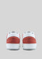 Back view of M0016 by Elton, a pair of retro-future sneakers crafted from premium Italian leathers with white soles against a plain grey background.