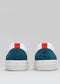 Back view of a pair of V28 White & Petrol Blue sneakers with teal heel accents and red pull tabs against a gray background, handcrafted in Portugal.